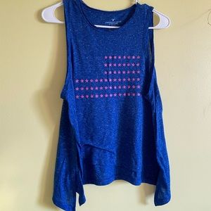 Blue tank top with a pink flag on the front